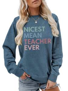 Detail of navy blue sweatshirt featuring NICEST MEAN TEACHER EVER colorful text design