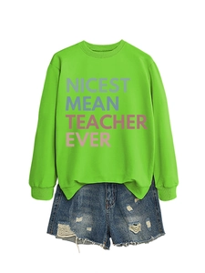 Detail of neon green crewneck sweatshirt with Nicest Mean Teacher Ever text print