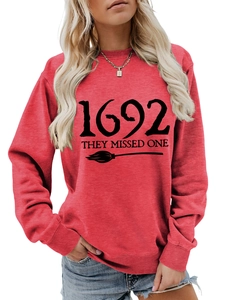 Macro detail of the 1692 they missed one text print on red cotton sweatshirt fabric