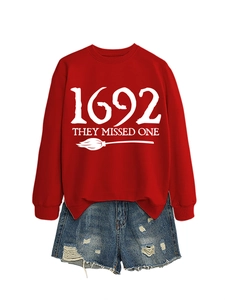 Detail of red crewneck sweatshirt with 1692 they missed one print and denim shorts