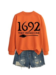Detail of 1692 they missed one printed orange sweatshirt with distressed denim shorts