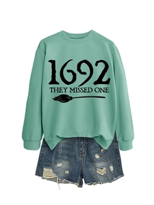 Detail of mint green 1692 they missed one sweatshirt with distressed denim shorts
