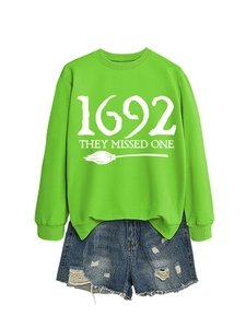 Neon green 1692 sweatshirt with blue distressed denim shorts on white background