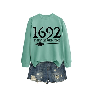 Mint green 1692 They Missed One sweatshirt paired with distressed blue denim shorts