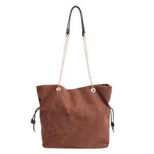 Minimalist brown suede tote bag featuring premium gold chain straps and drawstring details