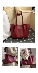 Detailed view of burgundy leather tote bag featuring metal rivets and long shoulder straps