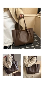 Detail view of large vintage brown tote bag showing smooth leather texture and silver studs