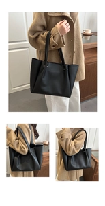 Detailed views of a black leather tote bag with silver rivets and spacious interior