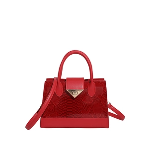 Glossy red faux leather handbag with crocodile pattern and golden triangle lock
