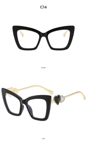 Detail of cat eye frame with golden temples and a decorative heart motif side view