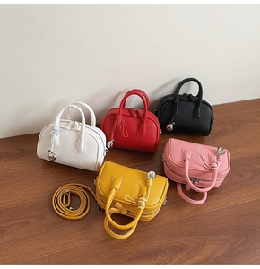 Collection of soft leather handbags in five colors with bells and detachable shoulder strap