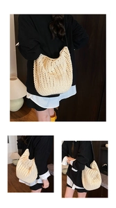 Macro detail of cream crochet hollow knit shoulder bag with slim black strap and texture