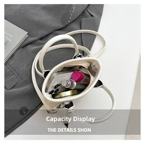 Internal capacity display of a beige leather handbag showing storage for phone and makeup