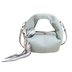 Chic light blue dumpling handbag with silk scarf wrap handle and adjustable strap