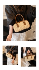 Detail of straw woven bag with brown leather handles and adjustable shoulder strap