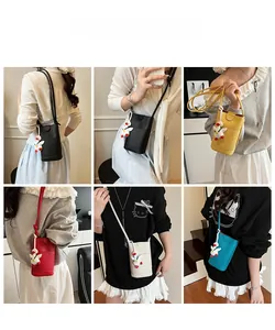 Litchi pattern cross-body phone bags in five colors with cute duck charms detail