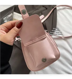 Pink PU leather crossbody bag featuring strong magnetic buckle closure and internal pockets