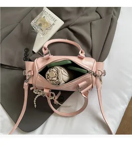 Interior view of pink Boston bag showing spacious compartment for phone and umbrella