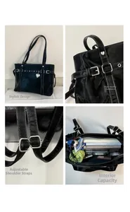 Detail view of black tote bag showing metal heart charm and spacious interior capacity