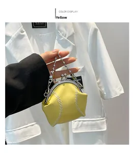 Mini yellow baseball shaped coin purse with white stitching and silver metal chain