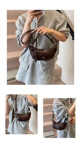 Detail of dark brown dumpling bag featuring curved stitching and branded metal logo