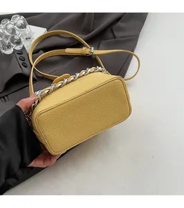 Detail of yellow lychee texture leather bag base with reinforced flat bottom support