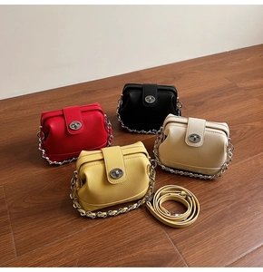 Mini doctor-style crossbody bags in red, black, yellow and beige with chain straps