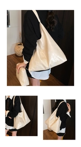 Detail view of large cream hobo tote bag and matching inner pouch with matte leather texture
