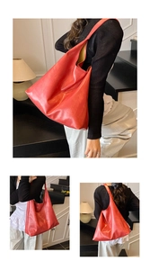Detailed views of the large red leather hobo bag with a minimalist shoulder design