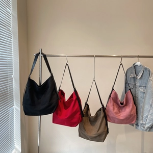 Minimalist large canvas tote bags in black, red, brown and pink with leather straps