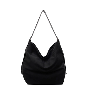 Minimalist black canvas hobo bag with leather strap for casual daily use