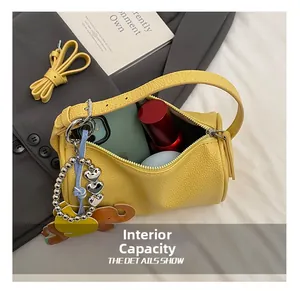 Macro shot of yellow leather cylinder bag interior showing high storage capacity