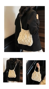 Detail of cream crochet shoulder bag showing intricate hollow diamond knit patterns