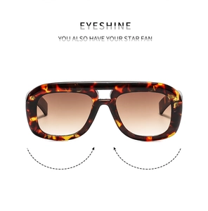 Detail of tortoise shell sunglasses frame with double bridge and brown gradient lenses