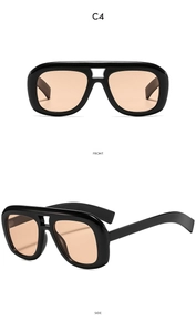 Detail view of model C4 pilot sunglasses with black frame and orange lenses