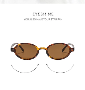 Macro view of retro oval sunglasses with tortoiseshell texture and metal rivet detail