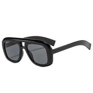 Modern oversized black double-bridge sunglasses with thick frames and dark lenses