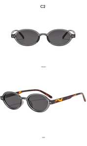 Front and side views of oval sunglasses with grey transparent frames and tortoiseshell temples