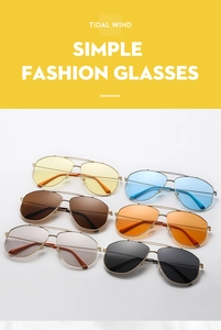 Detail of pilot sunglasses with dual-bridge metal frames in multiple vibrant lens colors