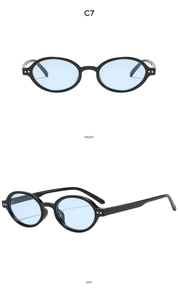 Macro detail of retro oval black sunglasses with light blue lenses and silver studs