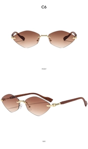 Détail de lunettes de soleil sans monture en forme de cœur avec pont doré et branches en bois