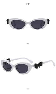 Vue avant et latérale de lunettes œil de chat blanches avec détail nœud 3D noir
