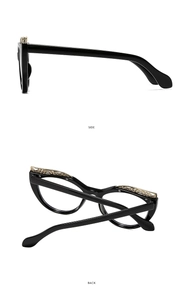 Detail view showing black eyeglass frames with elegant gold hollow metal patterns on side