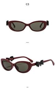 Vue détaillée de lunettes de soleil œil-de-chat Y2K bordeaux avec nœud noir sur le côté