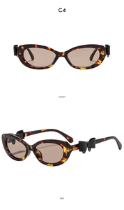 Vue détaillée de lunettes œil de chat écaillées avec nœud noir chic sur la branche