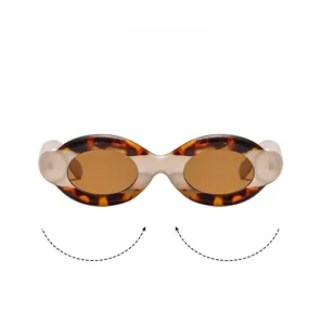 Macro detail of tortoiseshell oval frame texture and high-quality brown sun lens