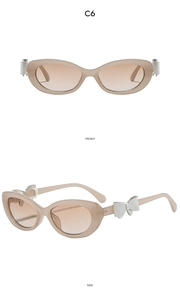 Détail de lunettes œil de chat nude avec verres dégradés et décor de nœud blanc aux branches