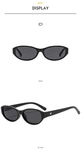 Detail view of oval cat eye sunglasses in black frame with silver temple accents