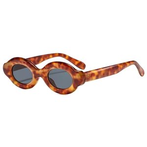 Retro chunky tortoiseshell oval sunglasses with dark lenses shown from a 45-degree angle
