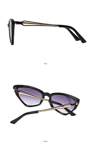 Detail view showing cat eye frame with purple gradient lenses and gold metal temples